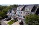 Overhead view of townhomes, showing garages, lush greenery, and multiple parked cars at 609 Sunfish Ln, Tega Cay, SC 29708
