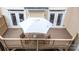 Aerial view of back deck featuring outdoor seating, an umbrella and access to the home at 609 Sunfish Ln, Tega Cay, SC 29708