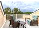 Relax on this charming balcony with comfortable wicker seating, offering a serene outdoor retreat at 609 Sunfish Ln, Tega Cay, SC 29708