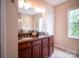 Large bathroom featuring a double vanity with granite countertops and ample lighting at 609 Sunfish Ln, Tega Cay, SC 29708