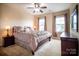 Comfortable bedroom featuring neutral walls, plush carpet, and a ceiling fan at 609 Sunfish Ln, Tega Cay, SC 29708