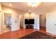 Bright bedroom boasts wood floors, recessed lighting, and convenient access to an en-suite bathroom and large closet at 609 Sunfish Ln, Tega Cay, SC 29708
