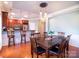 Dining room featuring hardwood floors, modern light fixtures and open access to the kitchen at 609 Sunfish Ln, Tega Cay, SC 29708