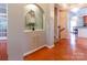 Bright entryway featuring hardwood floors, elegant chandelier, and a decorative niche at 609 Sunfish Ln, Tega Cay, SC 29708