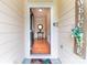 Inviting entryway with hardwood floors, neutral paint, and a decorative welcome sign at 609 Sunfish Ln, Tega Cay, SC 29708