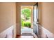 Bright entryway with hardwood flooring and views of the landscaped front yard at 609 Sunfish Ln, Tega Cay, SC 29708