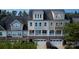 Aerial view of townhomes with stone accents, multiple windows, and well-maintained landscaping at 609 Sunfish Ln, Tega Cay, SC 29708