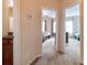 Upstairs hallway with doorways leading to multiple bedrooms and a full bathroom at 609 Sunfish Ln, Tega Cay, SC 29708