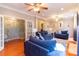 Spacious living room with hardwood floors, ceiling fans, and ample natural light at 609 Sunfish Ln, Tega Cay, SC 29708