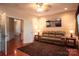 Comfortable living room with hardwood floors, a plush sofa, and ambient lighting at 609 Sunfish Ln, Tega Cay, SC 29708