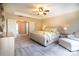 Elegant main bedroom with neutral decor, a sitting area, and an en-suite bathroom at 609 Sunfish Ln, Tega Cay, SC 29708