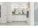 Well-lit bathroom with a double vanity, granite countertops, and a sleek, minimalist design at 619 R L Stowe Rd, Belmont, NC 28012