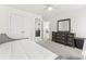Bedroom featuring white walls, a closet, and a modern dresser with mirrors at 619 R L Stowe Rd, Belmont, NC 28012