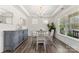 Cozy dining room with hardwood floors, elegant chandelier, and natural light at 619 R L Stowe Rd, Belmont, NC 28012