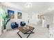 Open hallway with blue chairs, city art, and a view of the home's interior at 619 R L Stowe Rd, Belmont, NC 28012