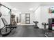 Spacious home gym with weightlifting equipment and access to the rest of the house at 619 R L Stowe Rd, Belmont, NC 28012