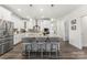Modern kitchen featuring a large center island with counter seating and stainless steel appliances at 619 R L Stowe Rd, Belmont, NC 28012