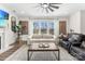Bright living room with fireplace, large windows, and comfortable seating at 619 R L Stowe Rd, Belmont, NC 28012