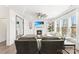 Bright living room with fireplace, white trim, ceiling fan, and large windows at 619 R L Stowe Rd, Belmont, NC 28012
