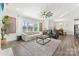 Open-concept living room and dining area with hardwood floors and ample natural light at 619 R L Stowe Rd, Belmont, NC 28012