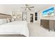 Bright and spacious main bedroom featuring neutral tones, a ceiling fan, and ample closet space at 619 R L Stowe Rd, Belmont, NC 28012