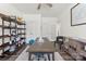 Office with built in storage shelving and cabinets, a long desk, and accent chair at 619 R L Stowe Rd, Belmont, NC 28012