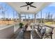 Relaxing screened-in porch featuring comfortable seating, a coffee table, and picturesque neighborhood views at 619 R L Stowe Rd, Belmont, NC 28012