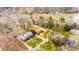 Aerial view of a home near a lake with a well-manicured lawn and mature trees at 651 25Th Nw Ave, Hickory, NC 28601