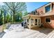 Expansive wooden deck featuring a grill and view of the sunroom, ideal for outdoor entertainment at 651 25Th Nw Ave, Hickory, NC 28601