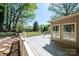 Elevated view from wooden deck showing backyard with outbuilding and well-maintained landscaping at 651 25Th Nw Ave, Hickory, NC 28601