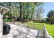 Backyard view from wooden deck, showing outbuilding, lush lawn, and manicured landscaping at 651 25Th Nw Ave, Hickory, NC 28601