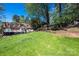 Backyard features a well-maintained lawn, a deck, and mature trees at 651 25Th Nw Ave, Hickory, NC 28601