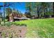 Backyard showcases a lush lawn and a home featuring a deck and patio at 651 25Th Nw Ave, Hickory, NC 28601