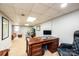 Finished basement featuring a wooden desk, workstation, and gray walls at 651 25Th Nw Ave, Hickory, NC 28601