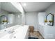 Bathroom featuring a double sink, vanity, mirror and tile floors at 651 25Th Nw Ave, Hickory, NC 28601