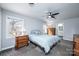 Comfortable bedroom featuring carpeted floors, a ceiling fan, and an ensuite bathroom at 651 25Th Nw Ave, Hickory, NC 28601