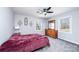 Bedroom with a carpet, neutral walls, ceiling fan, two windows, and a dresser at 651 25Th Nw Ave, Hickory, NC 28601