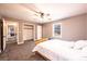Bedroom with gray carpet, neutral walls, ceiling fan and an open closet at 651 25Th Nw Ave, Hickory, NC 28601