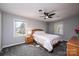 Bedroom with plush carpet, neutral walls, a ceiling fan and two windows at 651 25Th Nw Ave, Hickory, NC 28601