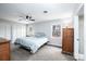 Bedroom with neutral walls, ceiling fan, two windows, plush carpet and closet at 651 25Th Nw Ave, Hickory, NC 28601
