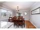 Dining room with hardwood floors, trim work, and a window view of an outdoor deck at 651 25Th Nw Ave, Hickory, NC 28601
