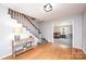 Entryway with hardwood floors, staircase, and an entryway to a living room at 651 25Th Nw Ave, Hickory, NC 28601
