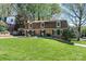 Attractive brick home with lush green lawn, well-maintained landscaping, and covered parking at 651 25Th Nw Ave, Hickory, NC 28601