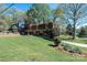 A charming house with mature trees and a lush lawn, featuring mature landscaping at 651 25Th Nw Ave, Hickory, NC 28601