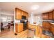 Cozy kitchen featuring wood cabinets, stainless steel appliances, and granite countertops at 651 25Th Nw Ave, Hickory, NC 28601