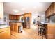 Spacious kitchen with wooden cabinets, granite countertops, stainless steel appliances, and breakfast bar at 651 25Th Nw Ave, Hickory, NC 28601