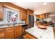 Well-lit kitchen with wooden cabinets, granite countertops and stainless steel appliances at 651 25Th Nw Ave, Hickory, NC 28601