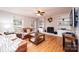 Cozy living room with a brick fireplace, built-in shelves, and hardwood floors at 651 25Th Nw Ave, Hickory, NC 28601