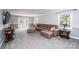 Spacious living room with carpeted floors, a comfortable sofa, and access to the backyard at 651 25Th Nw Ave, Hickory, NC 28601