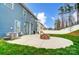 Large backyard with a stone fire pit and view of the rear of the home at 670 Belle Grove Dr, Clover, SC 29710